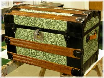 A beautiful round top trunk with embossed tin and wide slats before . And  below after a color change, new handles,  slats refinished, and relining along with the happy customer's comments
                              

Dear Gary,
Just wanted to let you know how much Ron and I love the job you did on the trunk.  It is beautiful...
....Hope to be able to get another trunk in April or sometime this summer.
Ron & Dee